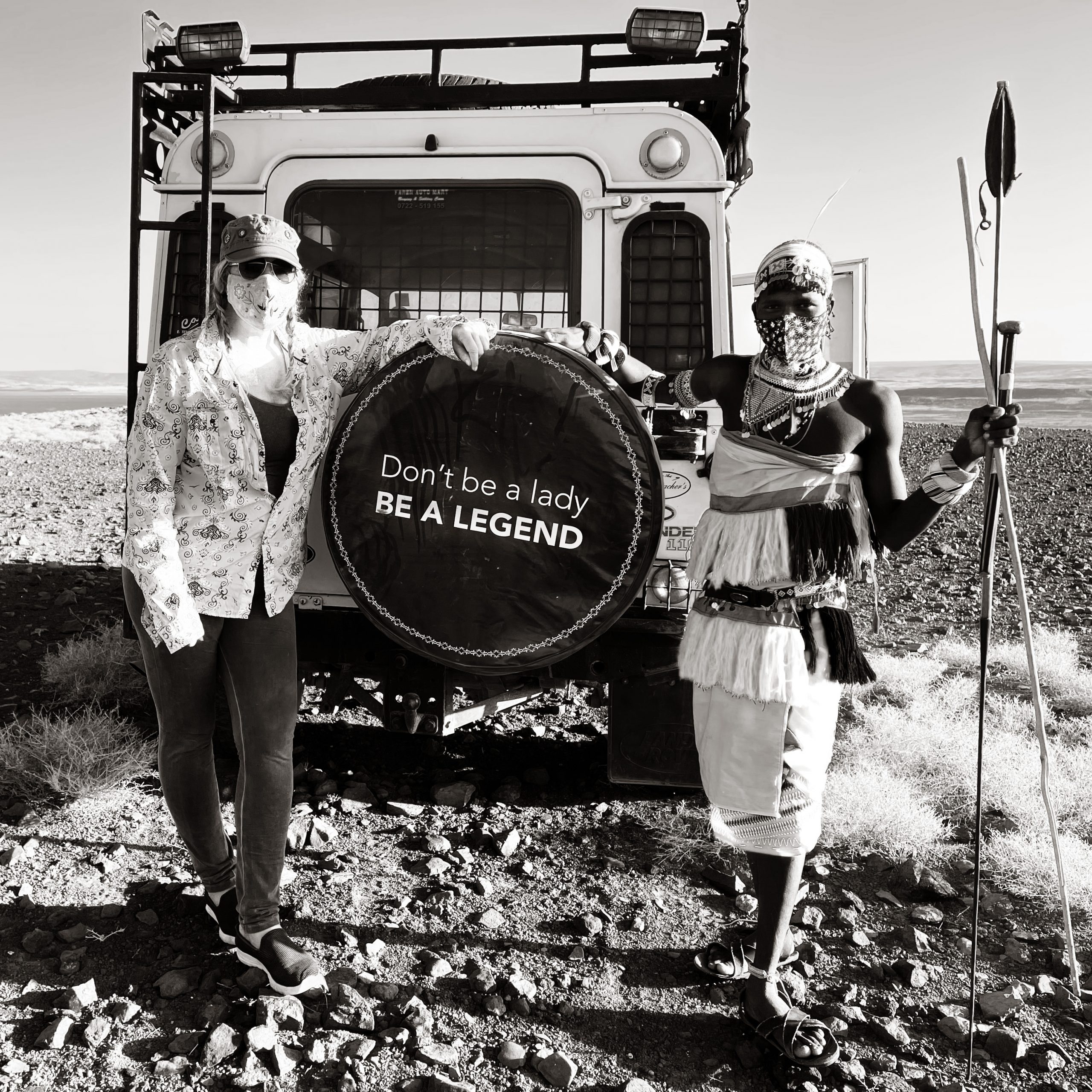 Piper Mackay standing with a warrior in front of her Land Rover